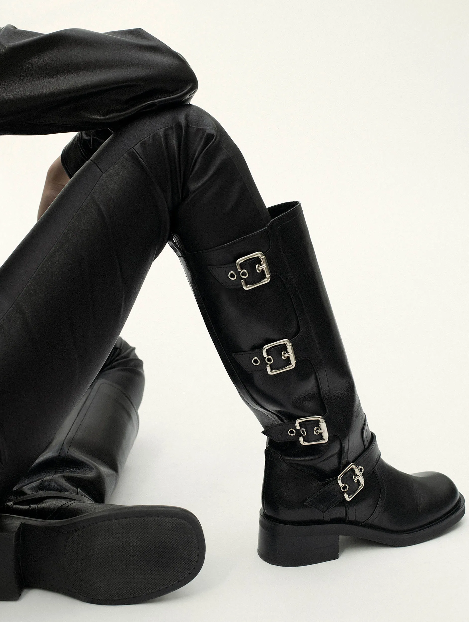 Multi-buckle biker boots in black leather